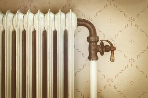 Retro styled image of an old central heating radiator Stock Photos