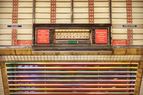 Retro styled image of an old jukebox with empty music labels Foto stock