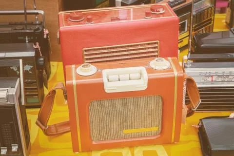 Retro styled image of old radio's for sale on a flee market Stock Photos