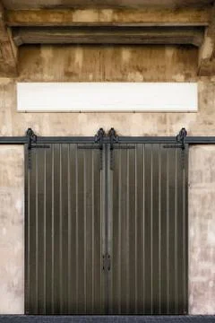 Retro styled image of an old warehouse entrance Photos