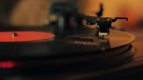 A retro-styled spinning record vinyl player. 4k. Close up Video stock 74864578