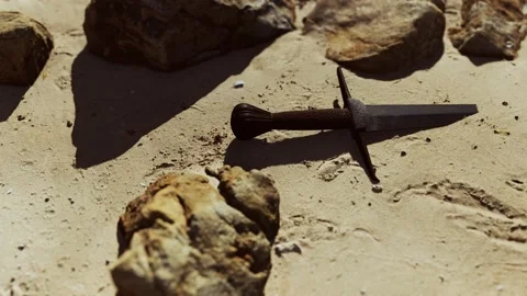 Retro sword on sand beach Video stock 150469571
