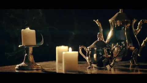 Retro Tea Set with Candlelight on Dark Background, Anamorphic Lens Stock Footage 284872911