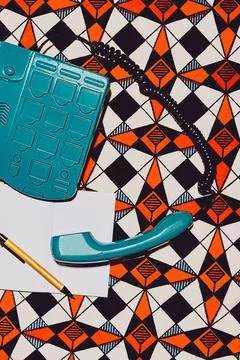 Retro telephone on geometric pattern Stockfoto's