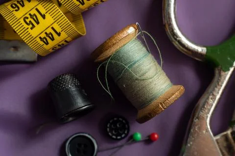 Retro tools for the work of a tailor, seamstress, fashion designer. Needle wi Stock Photos