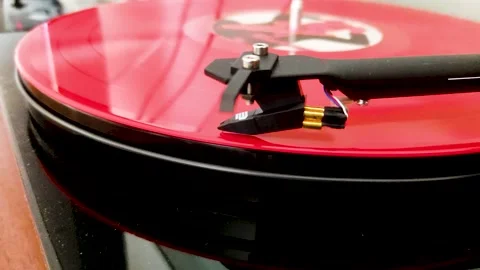 Retro Turntable System Playing a Red Vinyl Record Stock Footage 150958527