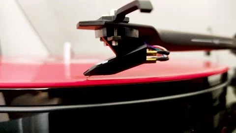 Retro Turntable System Playing a Red Vinyl Record. Close up View of the Needle Stock Footage 150959303