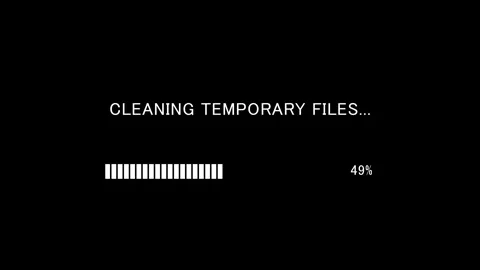 Retro TV screen showing cleaning temporary files text with loading bar Stock Footage 338371209