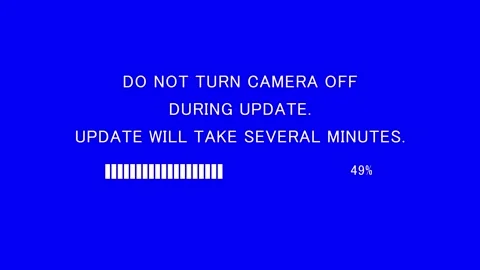 Retro TV screen showing do not turn camera off during update text Stock Footage 337937751