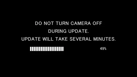 Retro TV screen showing do not turn camera off during update text Stock Footage 337938006