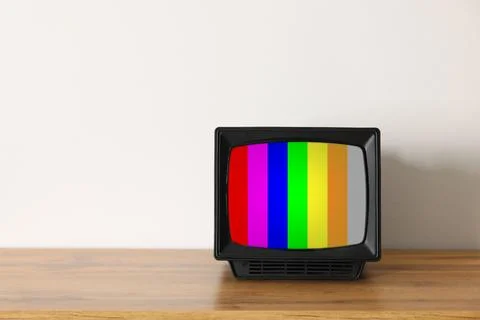 Retro TV set with test pattern on wooden table near white wall. Color bars .. 写真素材