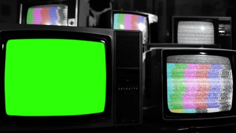 Retro TV Turning On Green Screen Among Many Vintage Televisions. BW Tone. Stock Footage 220958848