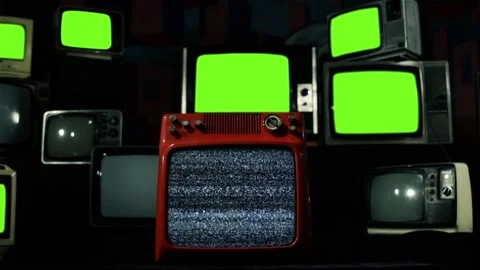 Retro TVs turning On and Off Green Screens Intermittently. Stock Footage