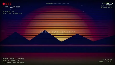 Retro VHS camcorder interface overlay with synthwave sunset landscape and Stock-Footage 345755691