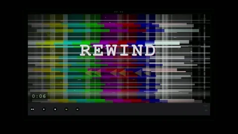 Retro VHS glitch effect with colorful static noise and rewind text on black Stock Footage 345759548