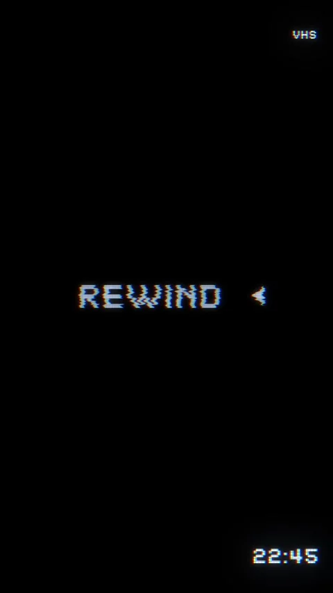 Retro VHS rewind text glowing pixel letters, double arrow icon, and black vintag Stock Footage 340567215