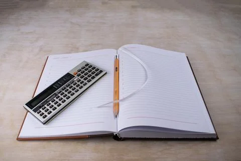 Retro vintage pocket computer data bank on a notebook pencil bookmarker Foto stock