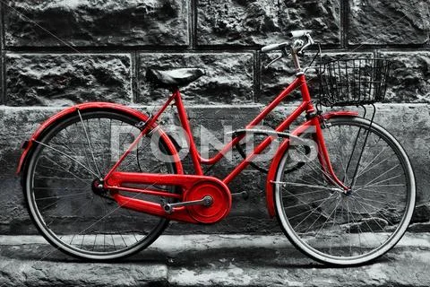 Retro vintage red bike on black and white wall. Stock-Fotos