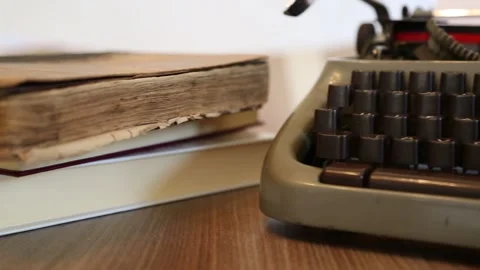 Retro Vintage Typewriter on a Table With Books Stock Footage 338027916