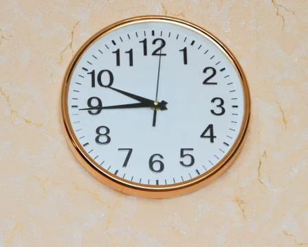 Retro wall clock on old ackground Stock Photos