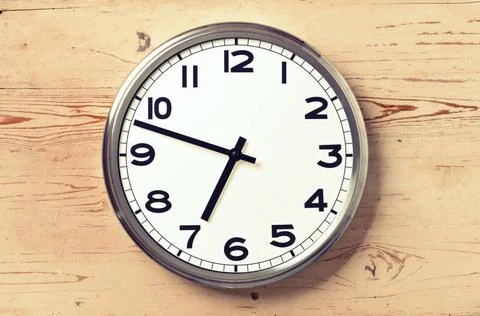 Retro wall clock retro wall clock on old wooden background Copyright: xZoo... Stock Photos