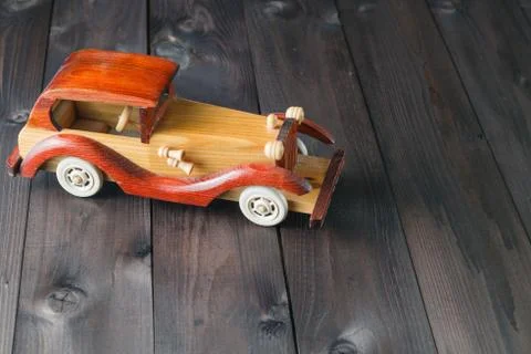Retro wooden toy car over wooden table. room for text Stock Photos