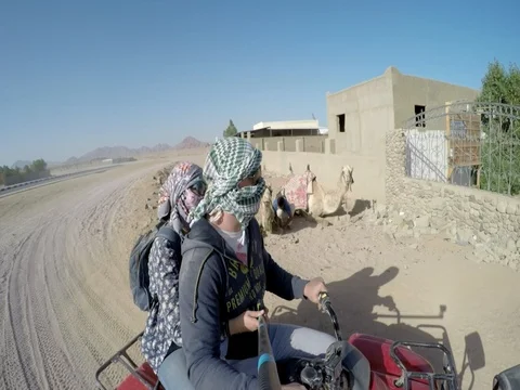 Return from the desert on an ATV with an instructor Stock Footage 73845300