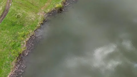 A return flight with the camera pointing straight down over the water's edg.. Stock Photos