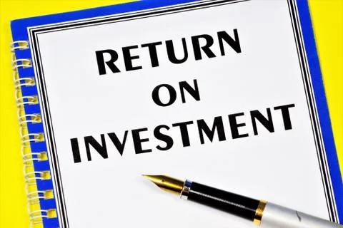 Return on investment-text label in the document on the folder. Stock Photos