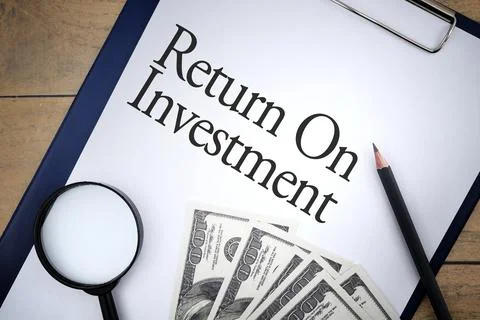 Return On Investment wording with selective focus of bank note,pencil, file h Stock Photos