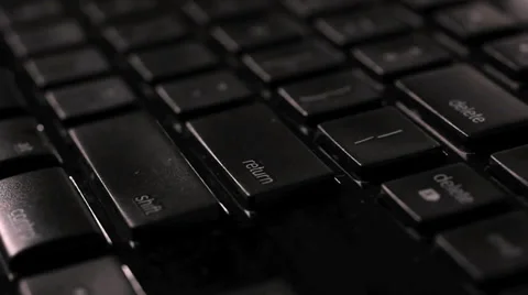 Return key is hit several times in a dark, moody room. Vídeos de archivo 37626079