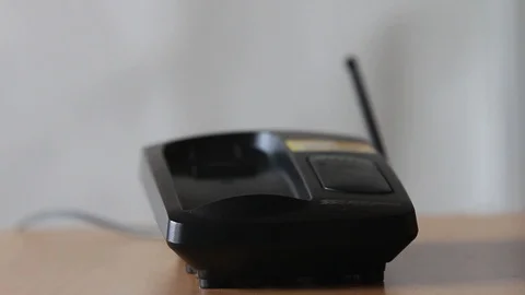 Return the phone to the base Stock Footage 97518098