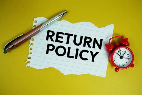 Return Policy text on paper torn with alarm clock top view on yellow backgrou Stock Photos