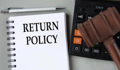 RETURN POLICY - words in a white notebook on the background of a calculator a Stock Photos