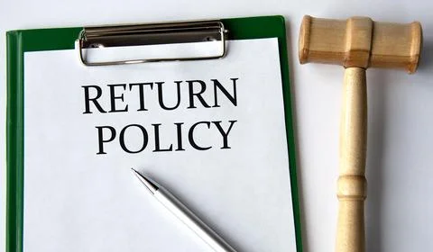RETURN POLICY - words on a white sheet on a white background and a judge's .. Stock Photos