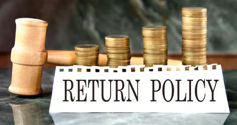 RETURN POLICY - words on a white sheet with a judge's gavel and a stack of .. Stock Photos