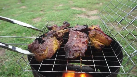 Return the pork to the grill on the stovetop prepared for the dinner menu. Stock Footage 163003862