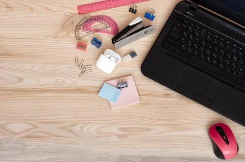 Return to school, study online, headphones on a wooden table Stock Photos