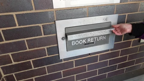 Returning Books to the Library Stock Footage 136532832