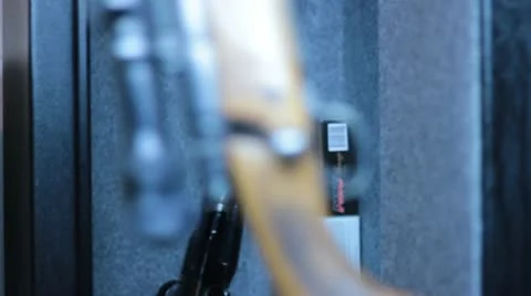 Returning rifles in a gun safe. Stock-Footage 21803082