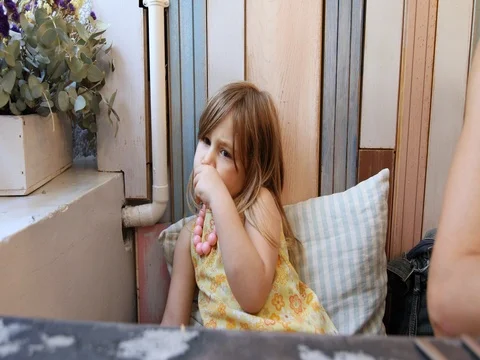 REUP little girl eating bread in restaurant Stock Footage