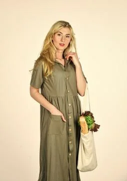 Reusable bag. Grocery store. Zero waste. Girl in dress carry shopper. Woman Stock Photos