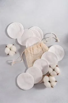 Reusable cotton pads with a drawstring pouch and cotton flowers, highlighting Stock Photos