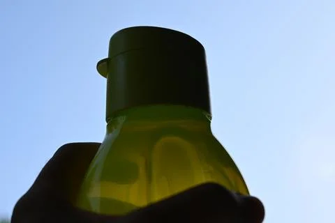 Reusable drinking bottle against the sky Stock Photos