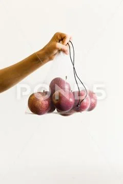 Reusable eco-friendly bag full of fresh seasonal apples on white background Stock Photos
