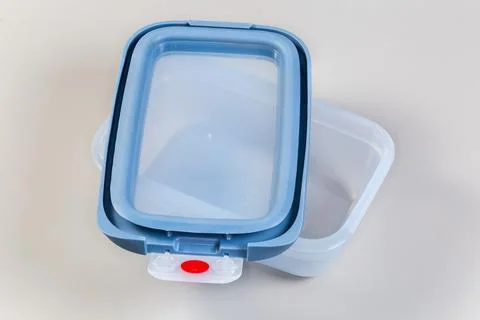 Reusable plastic lunch box and its lid upside down atop Stock Photos