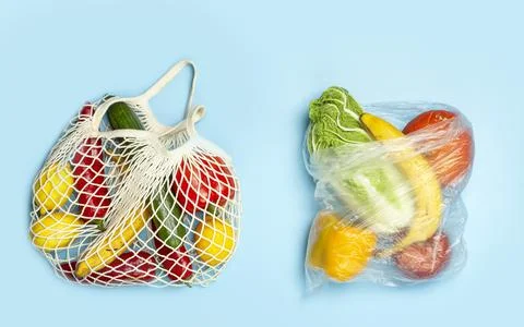 A reusable shopping string bag with vegetables and fruit from the supermarket Stock Photos