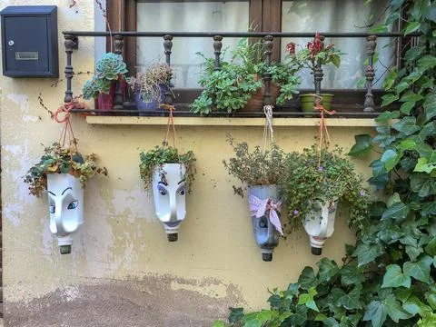 Reuse and decoration with solid waste to create flower pots. Stock Photos
