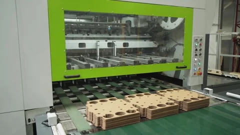 Reuse paper. Automatic line for production of brown cardboard boxes. Conveyor Stock Footage 280120374