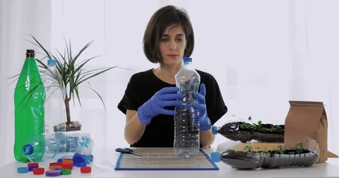Reuse plastic bottle to seeding plant. Recycling plastic concept. Stock Footage 129792120